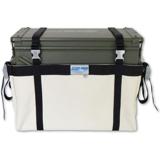 The Ammo Can Sling Harness by Down River Equipment features a green metal storage box inside a white and black canvas carrier with Phifertex Plus mesh, including straps and buckles.