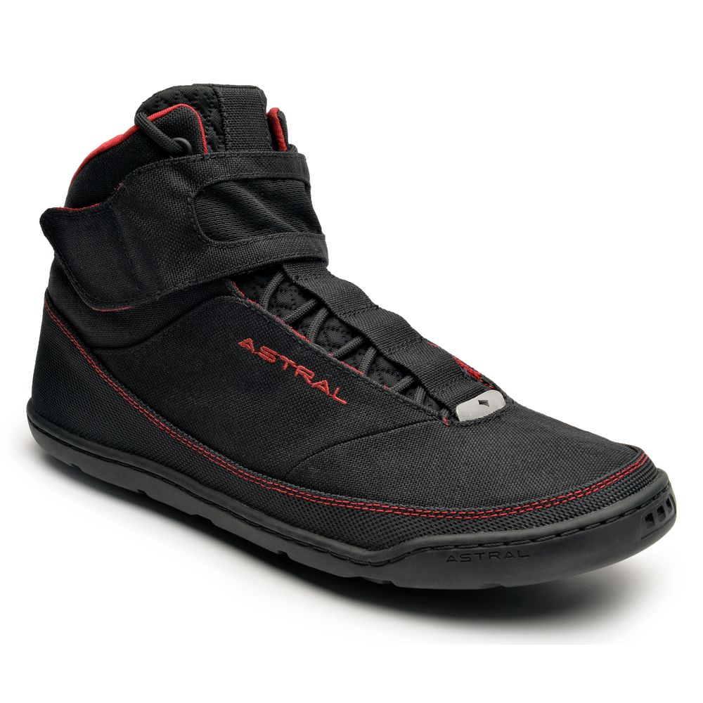 A black high-top sneaker with red accents and a Velcro strap. The brand name "Astral" is visible on the side.