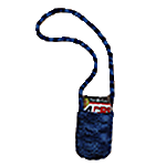 A small, blue knit shoulder bag with a long strap, holding a magazine or booklet inside.