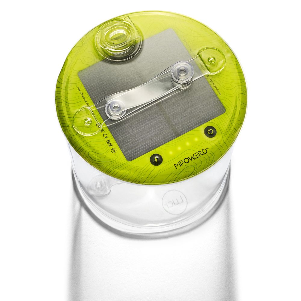 A close-up photo of a clear, cylindrical, portable solar lantern with a yellow-green top featuring solar panels and a white transparent body. The lantern is branded with MPOWERD.
