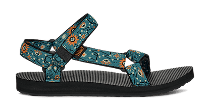 The DECKERS Women's Original Universal Sandal features teal and black geometric and orange sunburst patterns, adjustable recycled straps with the Universal Strapping System, an open toe, and a flat black sole.