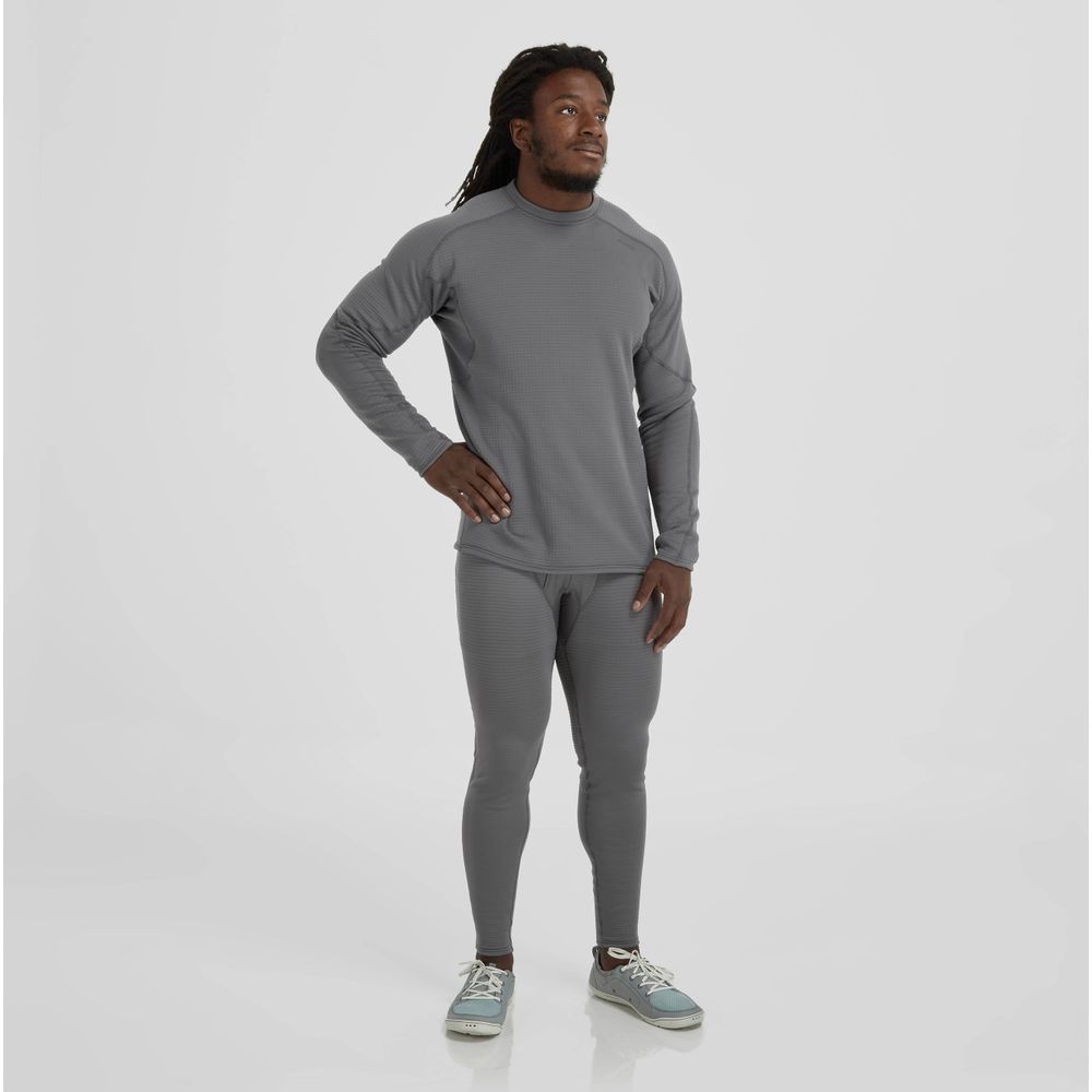 A person stands confidently in NRS Lightweight Pants and a matching grey top, hands on hips. The outfit features UPF 50+ protection and moisture-wicking fabric, creating a striking contrast against the plain white background.