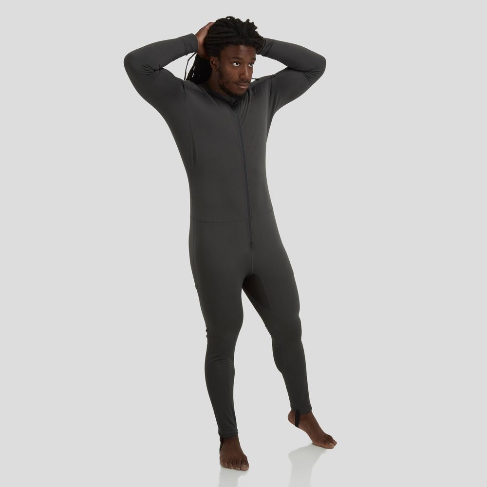A person stands with hands on head, wearing the NRS Expedition Weight Union Suit - Men's in dark gray, made from recycled material.