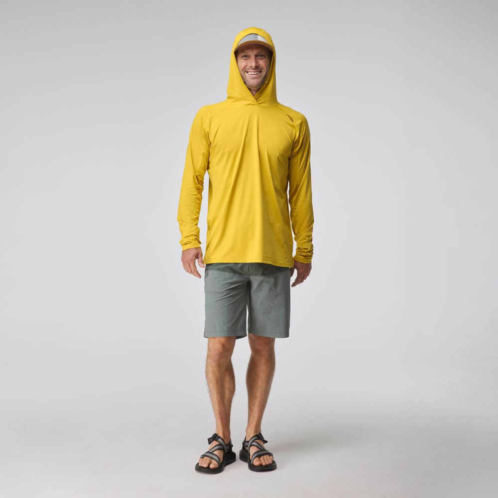 A man faces forward in the NRS Silkweight Hoodie for men in yellow, paired with gray shorts, black sandals, and a yellow cap, standing against a plain light background.