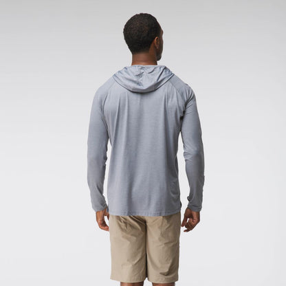 A man wearing the NRS Silkweight Hoodie - Men's in light gray with moisture-wicking properties and tan shorts stands facing away from the camera against a plain background.