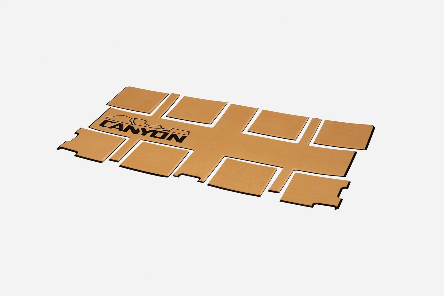 The Canyon Coolers Cooler Traction Pads are rectangular EVA foam boards with nine detachable sections and a mountain logo plus "CANYON" printed on the top left, offering durable grip for your cooler.