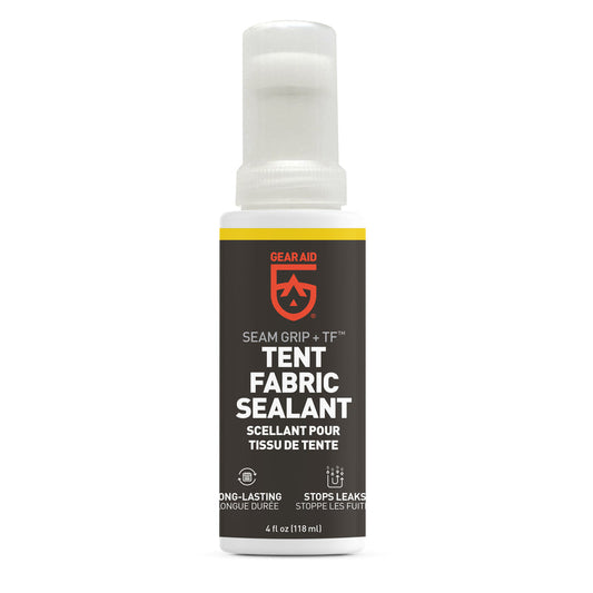 A 4 oz bottle of Gear Aid Seam Grip + TF Tent Fabric Sealant, with white cap and black label, is designed to stop leaks and provide long-lasting waterproofing for tent floors and outdoor gear.