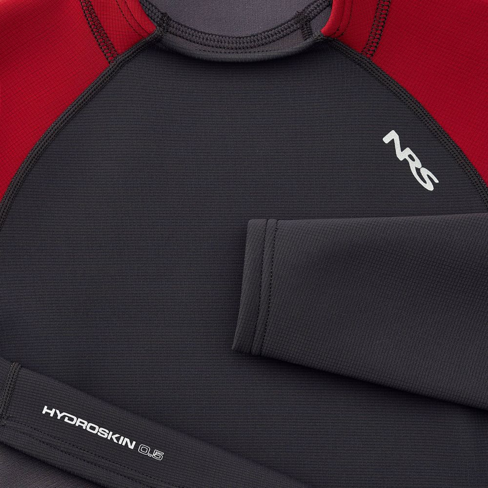 Close-up of the women's "Hydroskin 0.5mm Long Sleeve Shirt" by NRS in black and red, optimized for paddling. This insulating top provides warmth and flexibility, making it a must-have for any water enthusiast's gear collection.