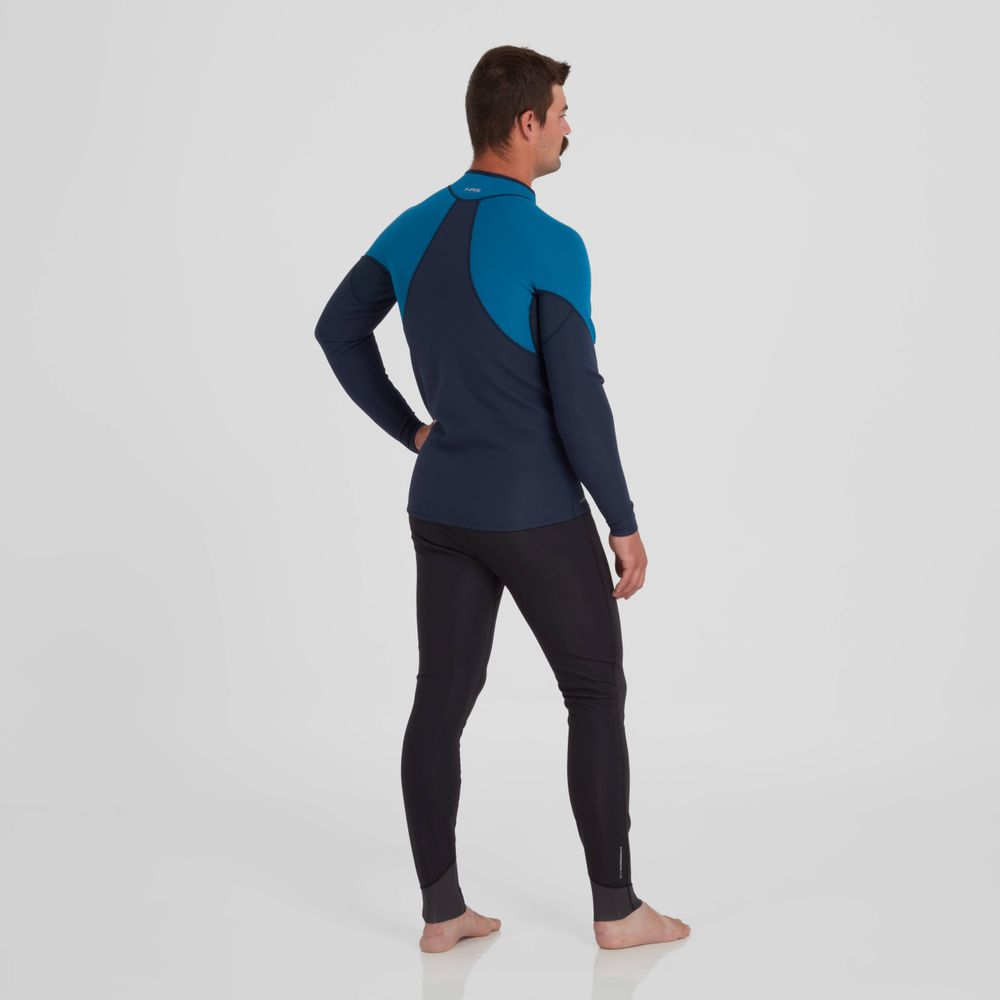 A man in an NRS Hydroskin 0.5mm Jacket, featuring neoprene warmth, stands barefoot on a plain white background facing away.