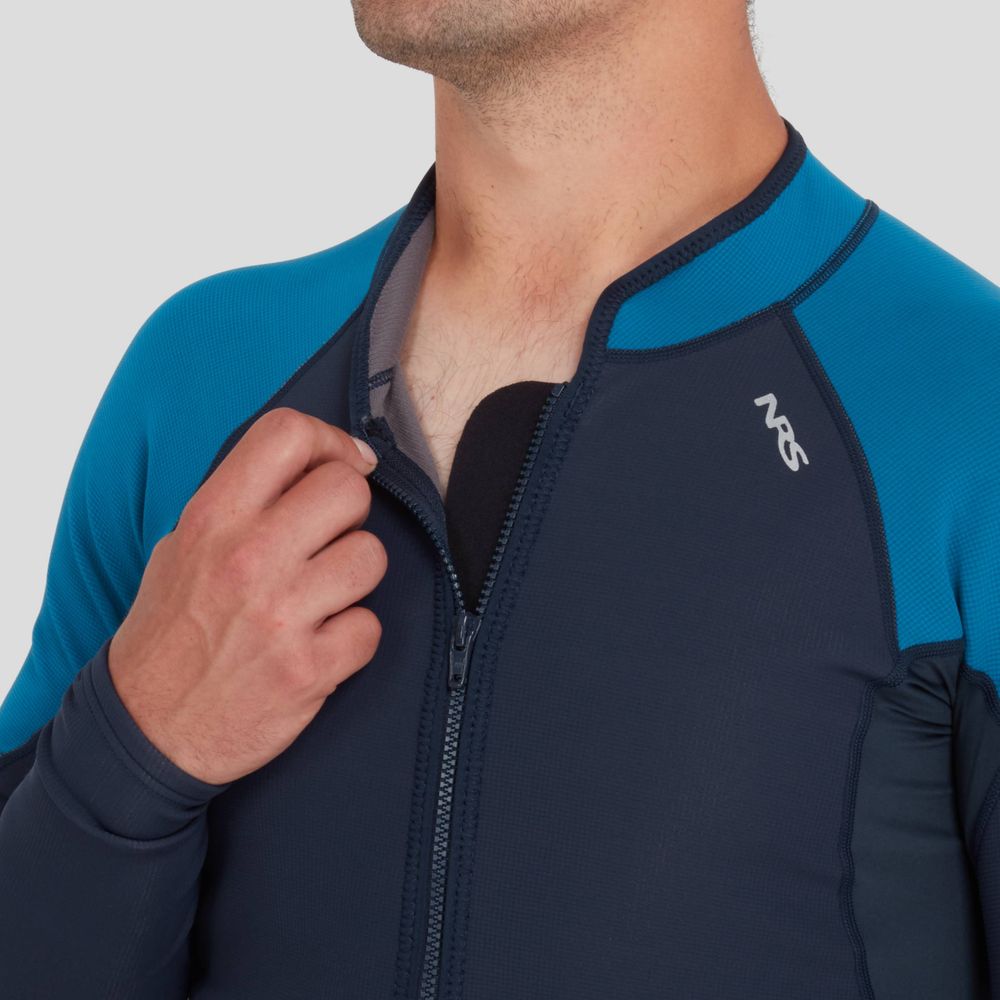 A person adjusts the zipper of their NRS Hydroskin 0.5mm Jacket, eager to fully enjoy the neoprene warmth it offers.