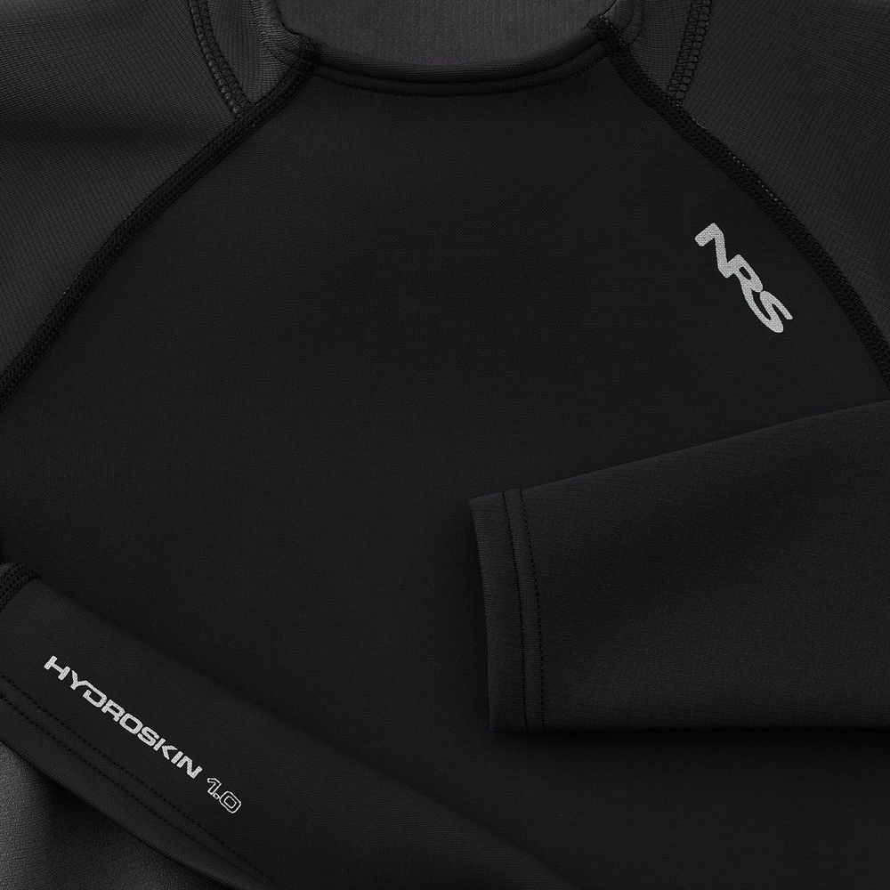 Close-up of a black neoprene long sleeve shirt featuring the "NRS" logo and "Hydroskin 1.0" branding, highlighting its wetsuit-style fit to ensure neoprene protection.