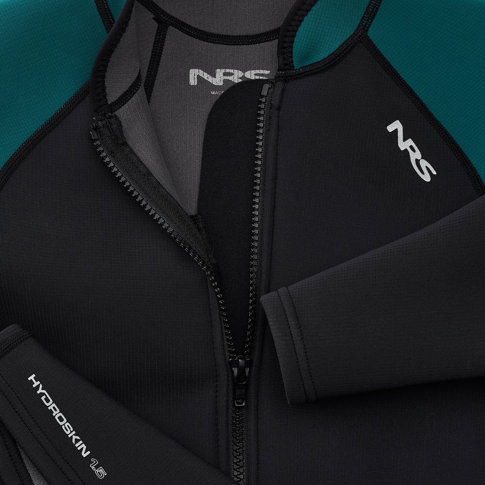 Close-up of a black and teal NRS Hydroskin 1.5mm Jacket - Women's, partially unzipped to reveal the neoprene insulation and detailed stitching. Designed for optimal paddling performance, this jacket showcases excellent craftsmanship in its inner lining.