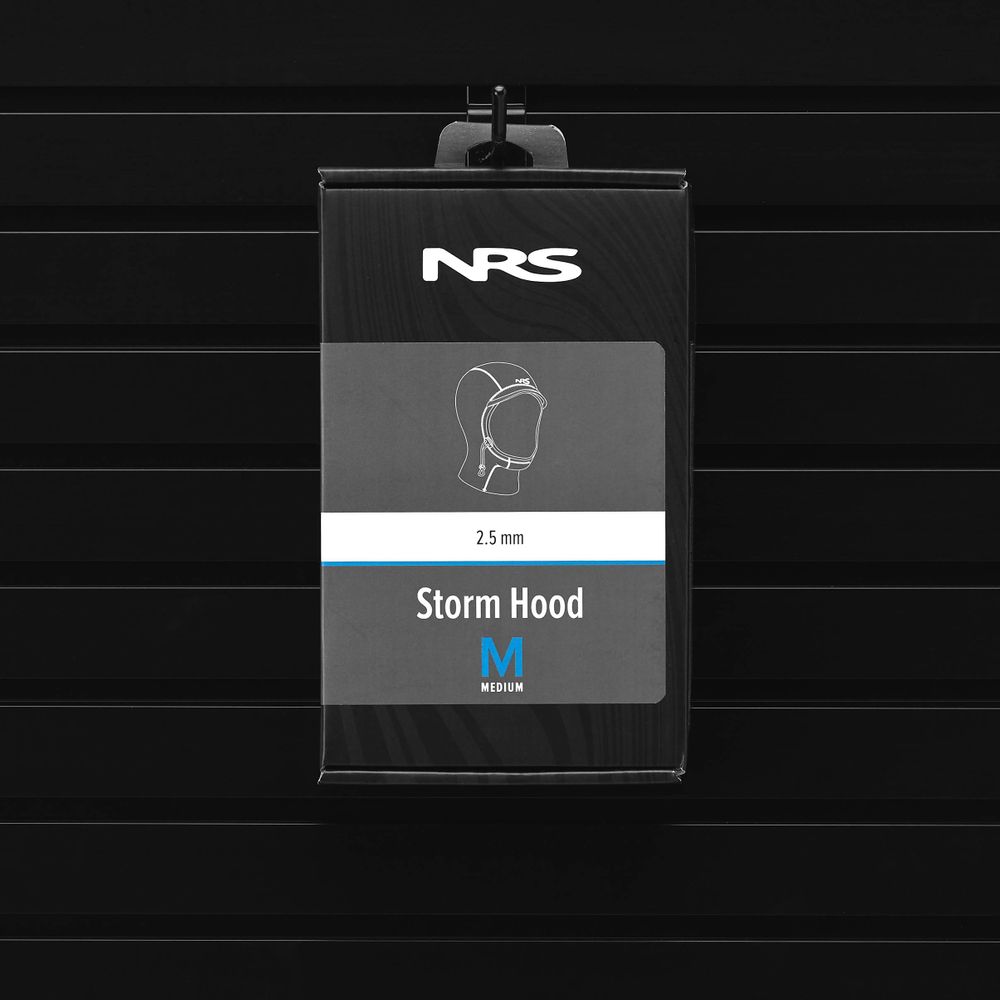 The NRS Storm Hood, with its ThermalPlush lining and 2.5 mm thickness in size medium, provides cold water protection. Displayed on a black slat wall, it combines practicality and style for modern adventurers.