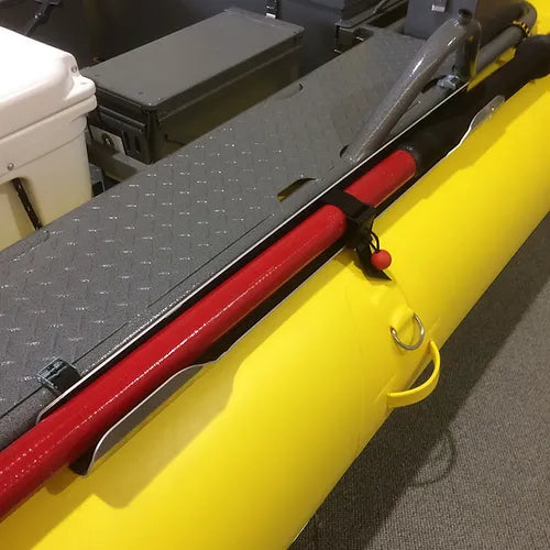 A yellow SDG River Gear boat with a red SDG Oar Holster attached to it.