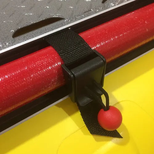 A red SDG River Gear ball is attached to the handle of a SDG Oar Holster kayak.