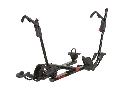 a black Yakima HoldUp Bike Rack with two handles on it.