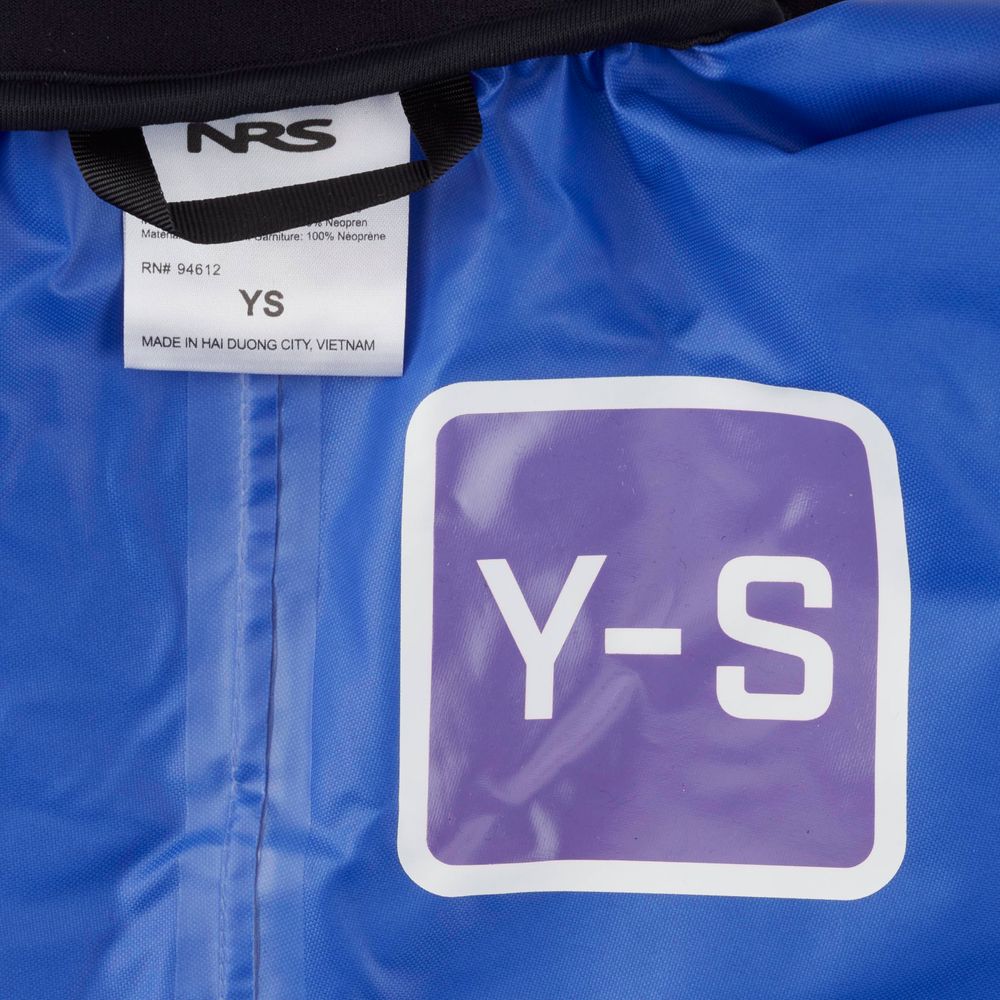 The close-up shows a label with "NRS" and "YS," featuring a purple square marked "Y-S." This is the NRS Youth Rio Splash Top, a waterproof paddle jacket made in Hai Duong City, Vietnam.