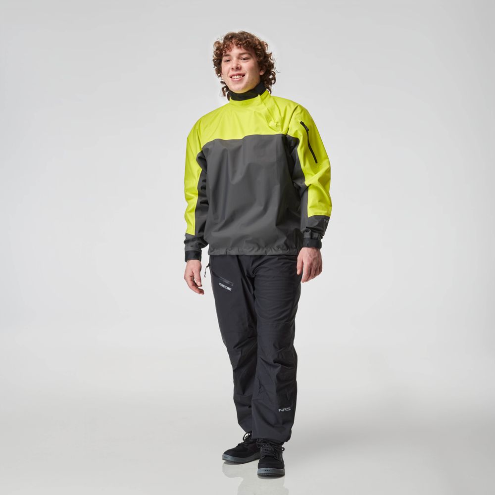 A person in a black and neon green tracksuit, perfectly completed with the NRS Endurance Splash Jacket - Men's, stands smiling against a plain background.
