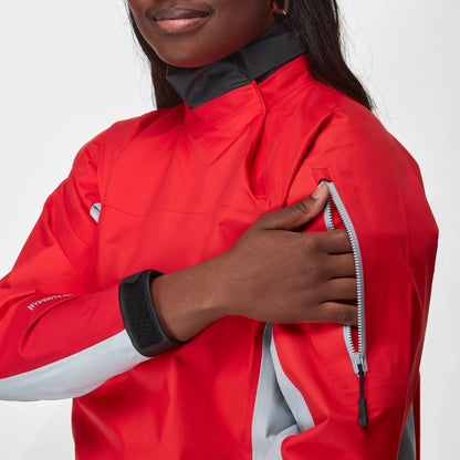 A person wearing the NRS Endurance Splash Jacket - Women's in red unzips a pocket on the upper sleeve.