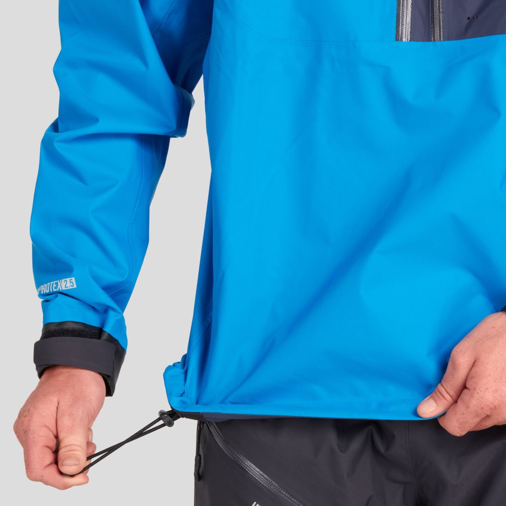 A man in the NRS High Tide Jacket adjusts the hem drawstring, highlighting its adjustable hood for enhanced paddling protection.
