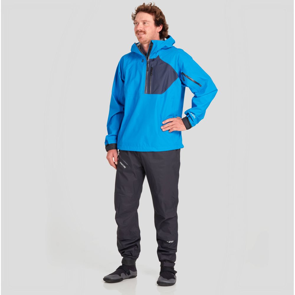 Man wearing a NRS High Tide Jacket - Men's, blue and gray breathable, with matching pants, standing with a hand on his hip.