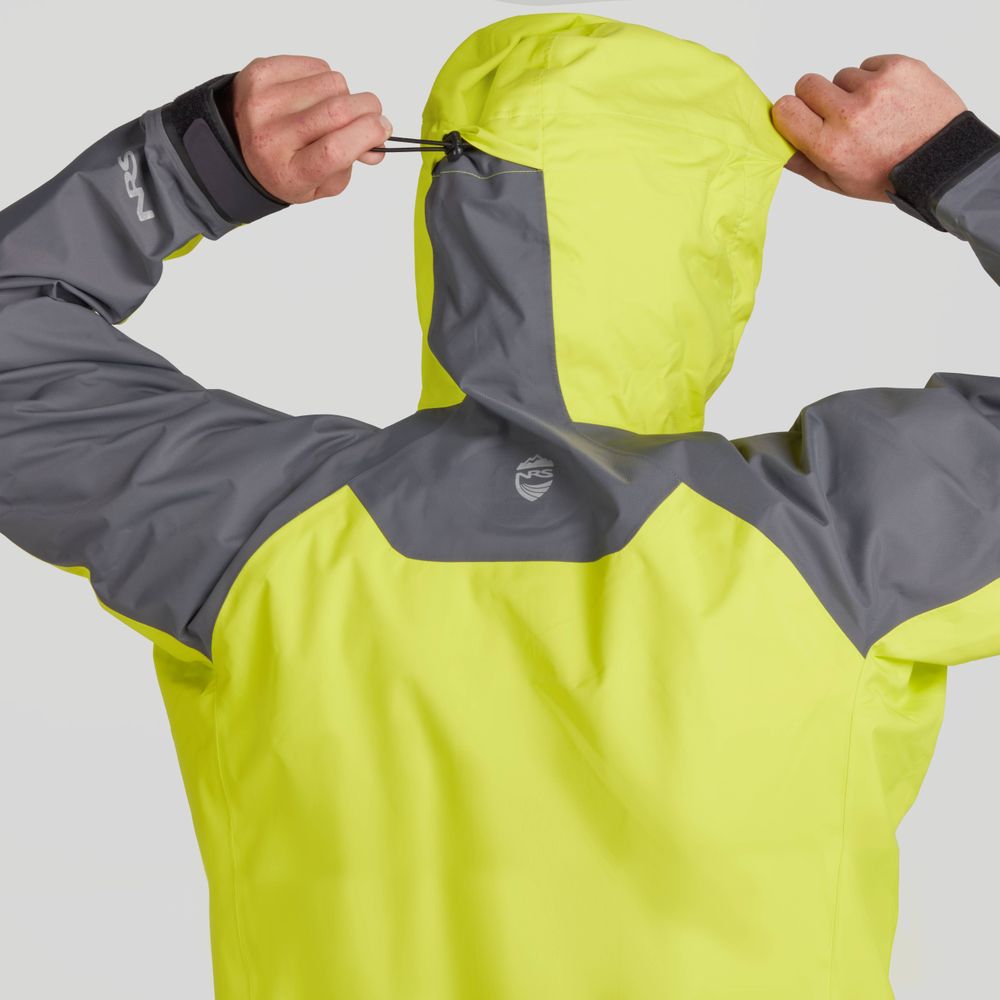 A person adjusts the hood of their NRS High Tide Jacket - Men's, providing paddling protection with its yellow and gray waterproof design on a rainy day.