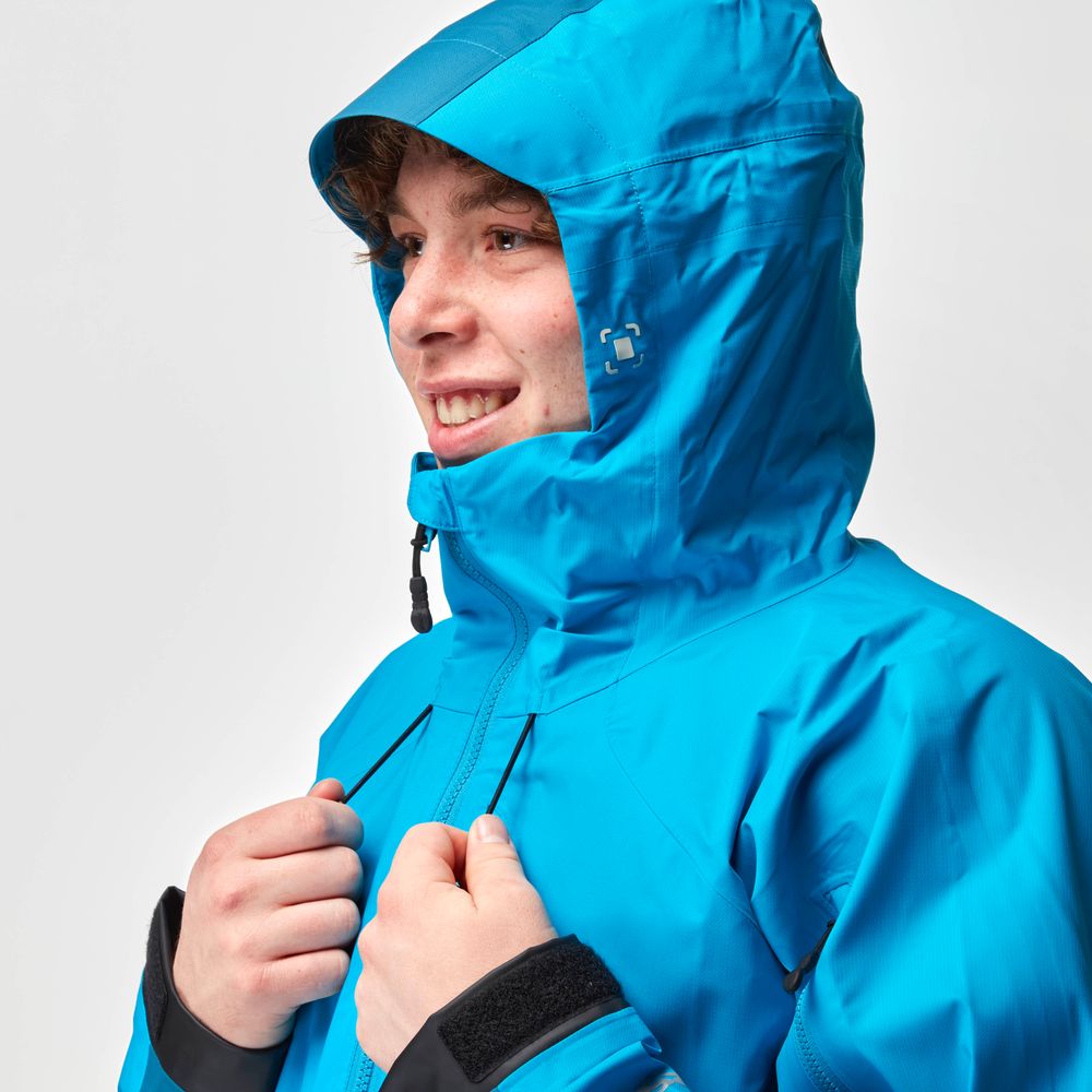 A person wearing the NRS High Tide Jacket - Men's in bright blue, hood up, is smiling and holding the breathable collar.