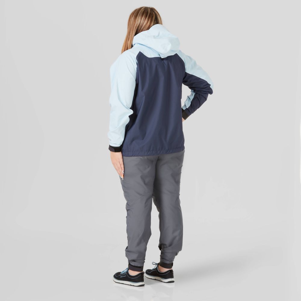 A person wearing the NRS High Tide Jacket - Women's, featuring a two-tone breathable design, stands with their back to the camera on a gray background while also donning gray pants.