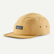 The P-6 Label Maclure Hat by Patagonia is a yellow five-panel cap featuring a small logo patch on the front and metal side eyelets.