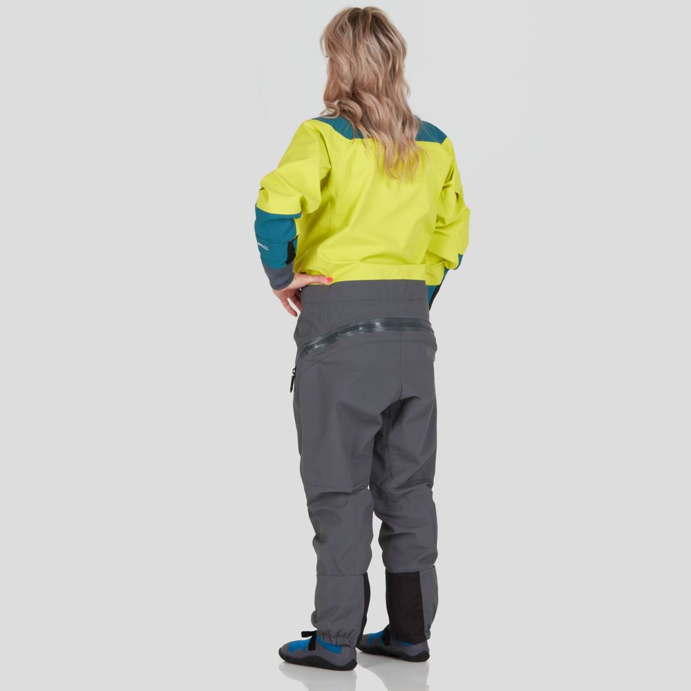 An individual faces away from the camera wearing an NRS Nomad GORE-TEX Pro Semi-Dry Suit for women in yellow and gray, highlighting its exceptional waterproof performance against a simple backdrop.