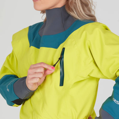 In a Nomad GORE-TEX Pro Semi-Dry Suit for women by NRS, in bright yellow and teal, the person adjusts the zipper of a small chest pocket.