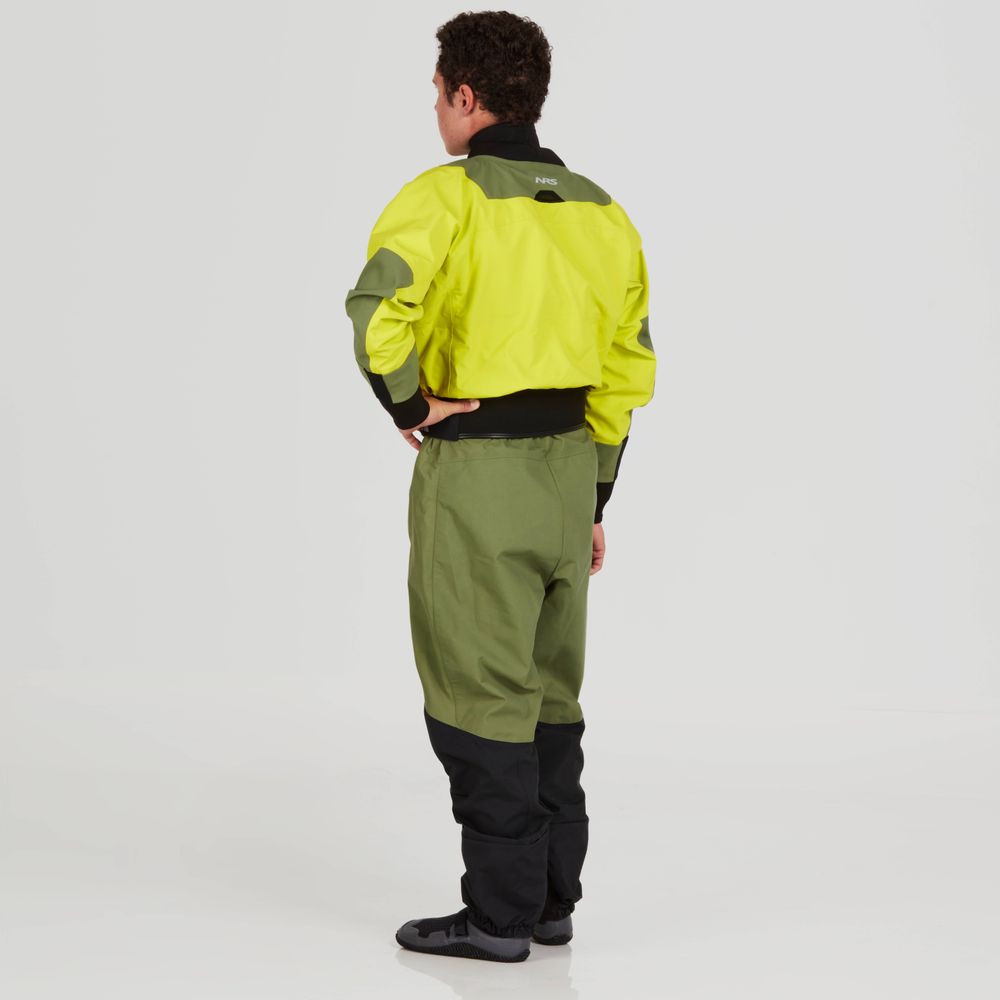 A person stands confidently with hands on hips, wearing the NRS Axiom Drysuit - Men’s made from recycled nylon GORE-TEX Pro fabric. The yellow and green suit features black cuffs and lower legs, providing waterproof, windproof, and breathable protection.