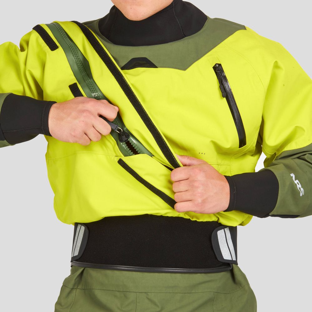 An individual adjusts a chest zipper while wearing an NRS Axiom (GORE-TEX Pro) Men's Drysuit in green and yellow, made from recycled nylon fabric.