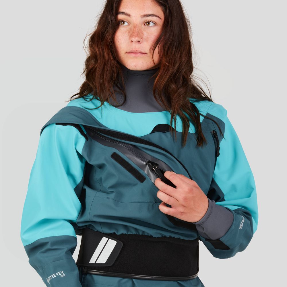 A person in an NRS Axiom GORE-TEX Pro Drysuit for women, featuring a teal and gray design, glances sideways against a plain backdrop, highlighting its waterproof, windproof, and breathable qualities.