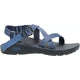 A blue Chaco ZCloud - Women's sandal with adjustable straps, a black textured sole with Cloud Cushioning, a ChacoGrip rubber outsole, and a side buckle is shown against a white background.