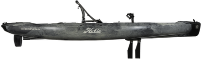 A Mirage Compass 12 Pedal Drive Kayak equipped with a fishing rod by Hobie.