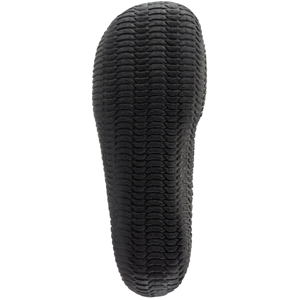 The image features the NRS Comm-3 Youth WetShoe's high-traction rubber sole with a wavy pattern, viewed from the bottom.