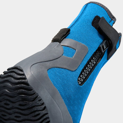Close-up of the NRS Paddle Wetshoe - Women's in blue and gray neoprene with a textured sole, side zipper, and black strap. This footwear is perfect for comfort and durability during aquatic adventures.
