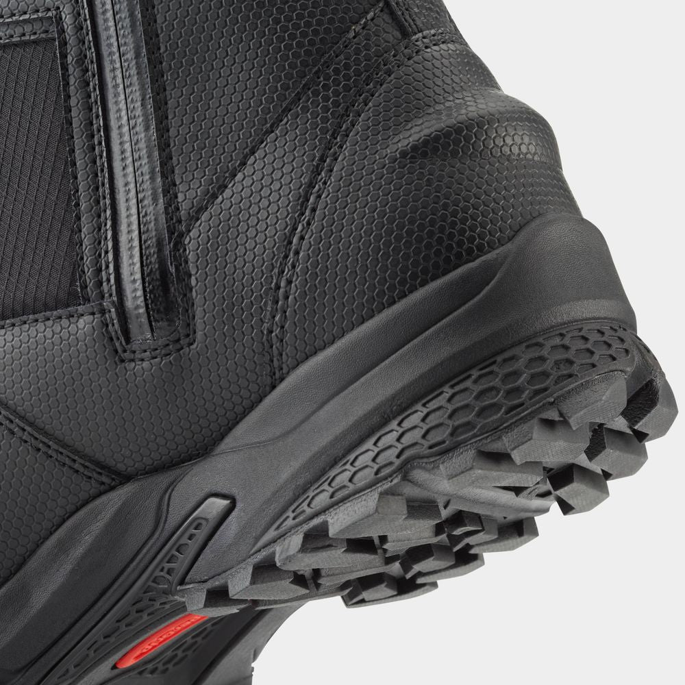 Close-up of a Storm Boot by NRS showcasing its black textured design with a HyperGrip rugged sole, zipper, and red side detail. Built for quick-drying performance, this stylish boot effortlessly combines functionality with fashion.