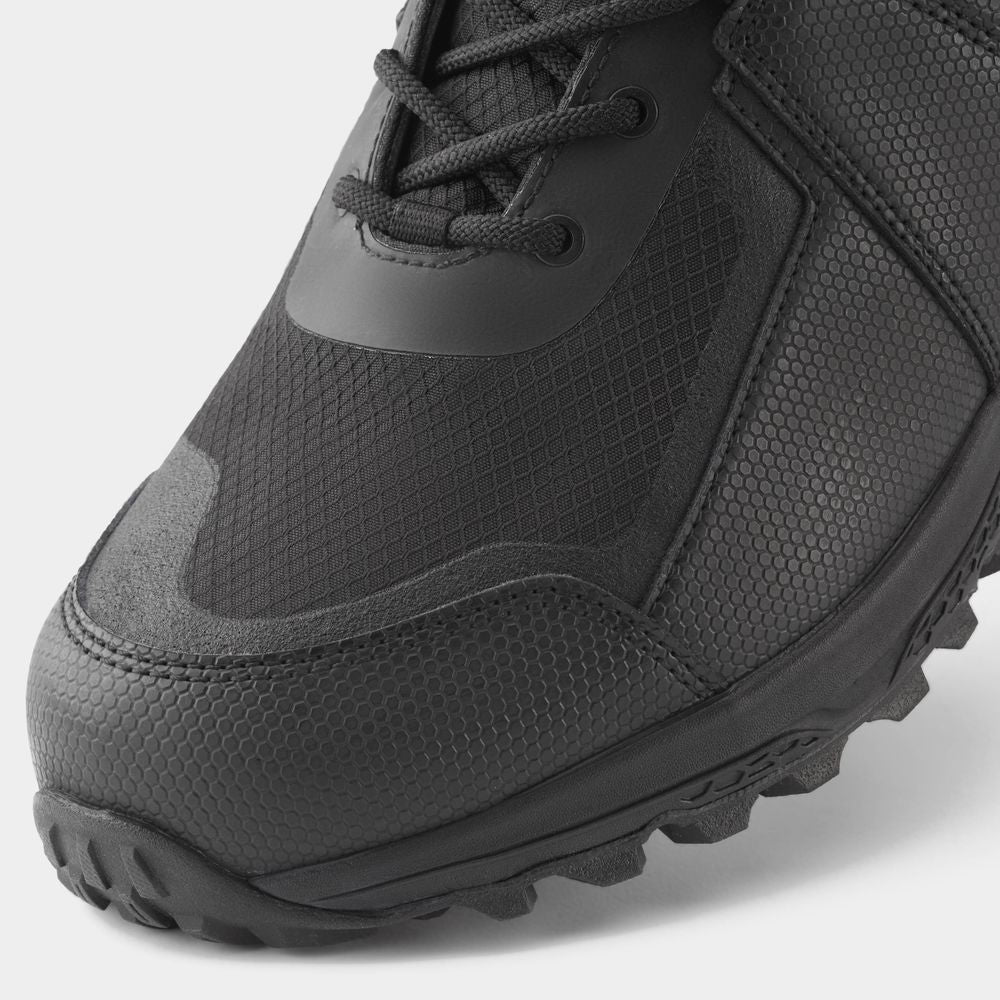 Close-up of NRS Storm Boot, a black athletic shoe with textured fabric and rugged wetshoe design featuring HyperGrip sole. The image displays front and side views, showcasing its quick-drying performance suitable for any adventure.