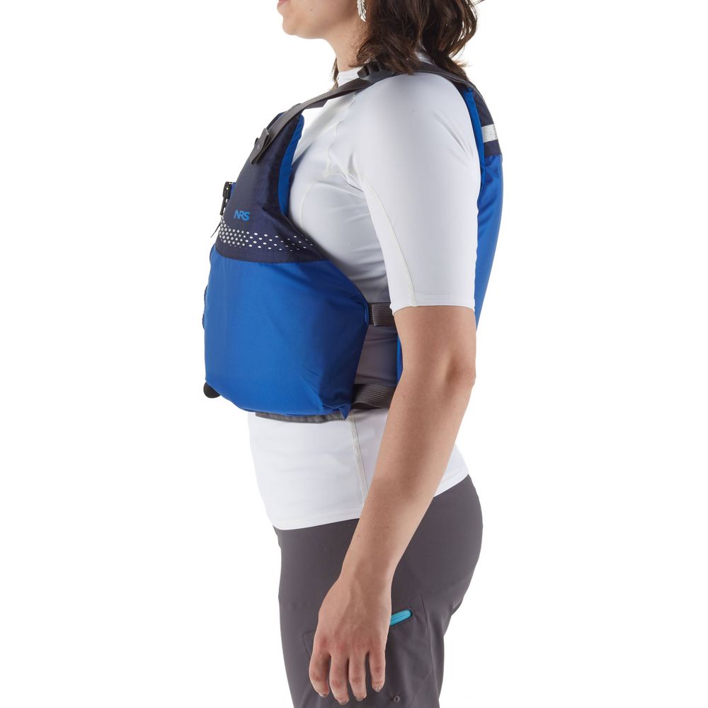 A person wearing the NRS Vista PFD, a certified blue life jacket ideal for beginners, stands in profile over a white shirt and gray pants against a plain white background.