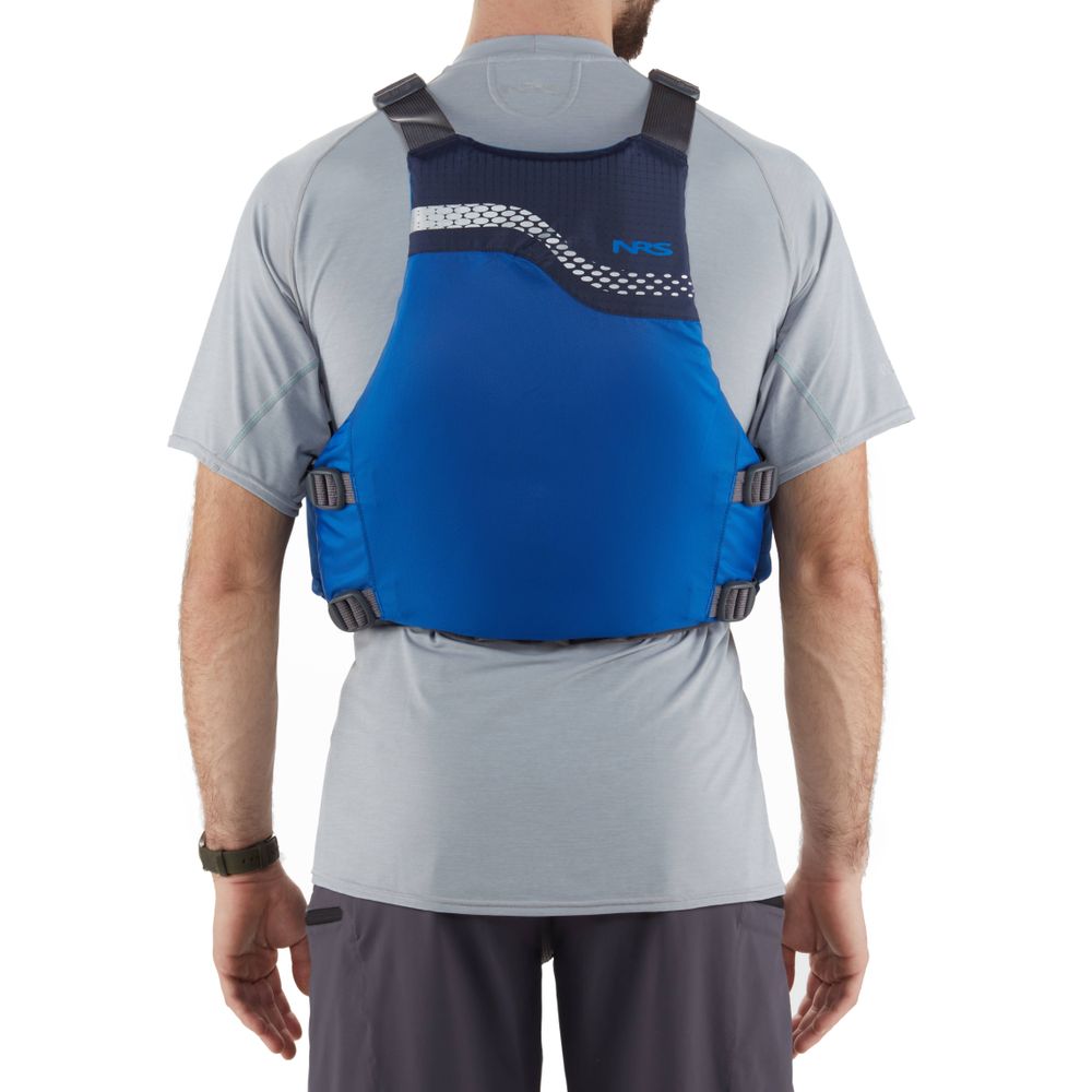 A person in a gray shirt and black shorts is seen from behind wearing the NRS Vista PFD in blue, certified by the US Coast Guard.