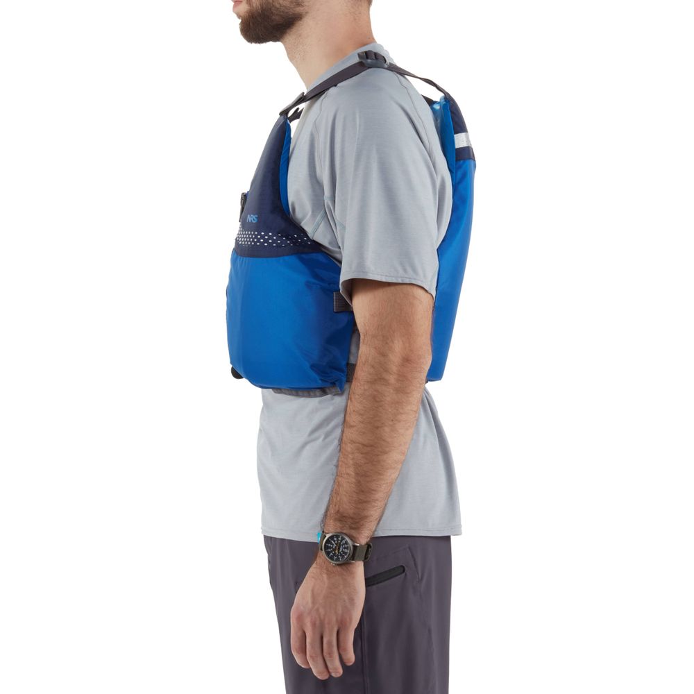 Person in profile wearing the NRS Vista PFD, a US Coast Guard certified blue life jacket, over a grey short-sleeve shirt and dark pants.