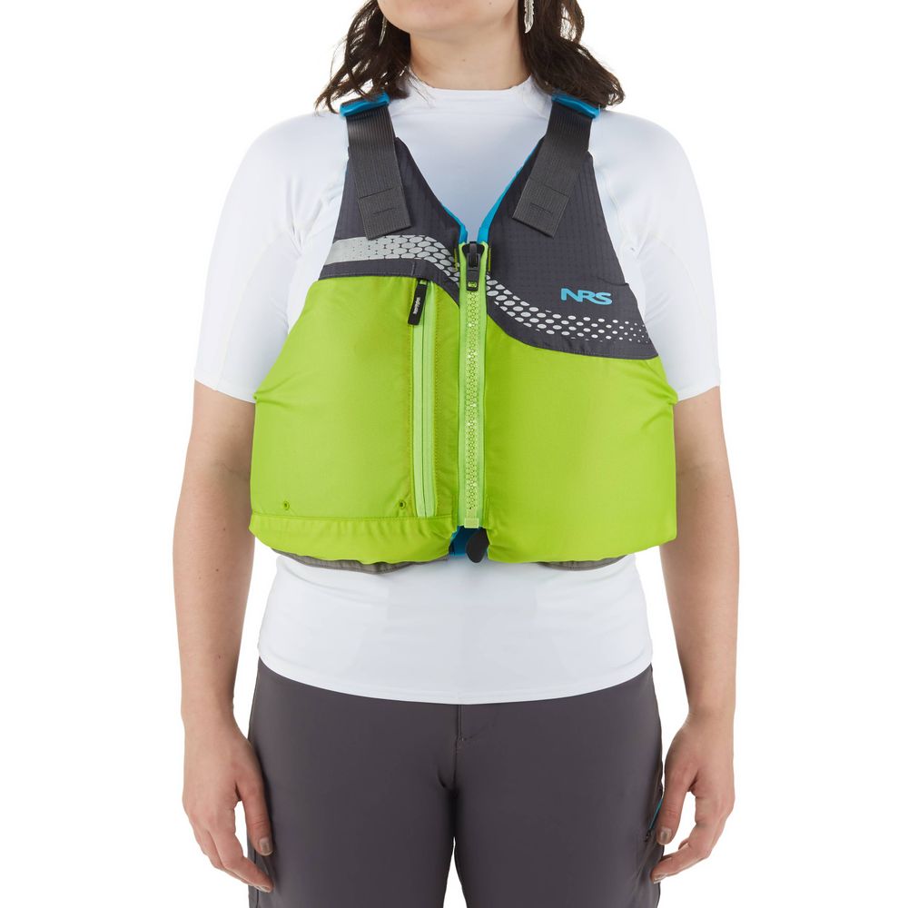 A person is wearing the NRS Vista PFD in lime green and black over a white shirt and gray pants, blending style with safety due to its US Coast Guard Certification.