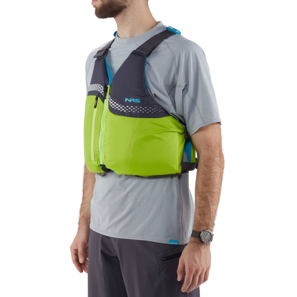 Someone is wearing the NRS Vista PFD, a bright green US Coast Guard-certified life jacket, over a gray shirt and dark shorts.