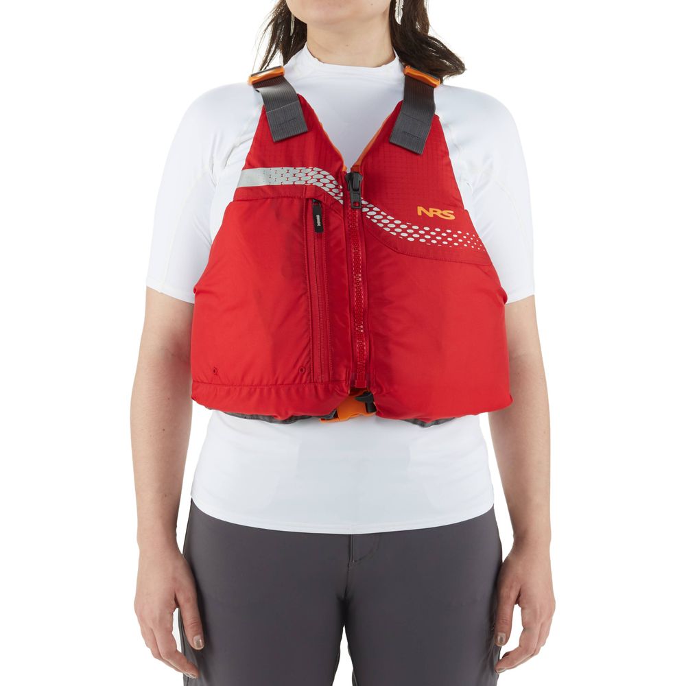 A person wearing an NRS Vista PFD, a red life jacket with US Coast Guard Certification, over a white shirt and gray pants, standing with arms at sides.
