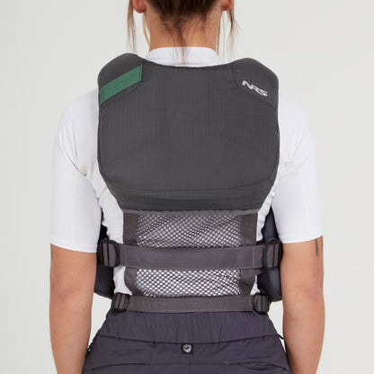 A person faces away, wearing the NRS Chinook Fishing PFD—black and gray with mesh panel and adjustable straps—over a white shirt, against a plain background.