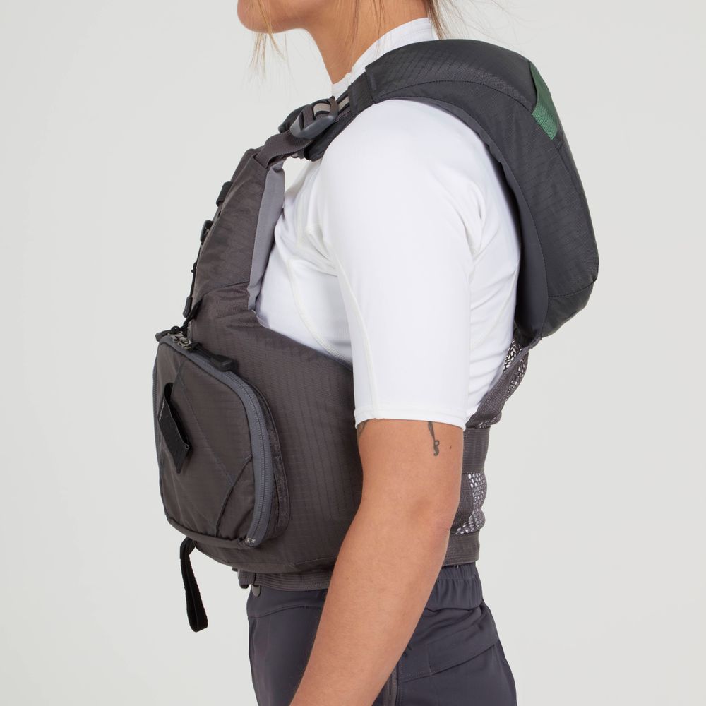 A person in a white short-sleeve shirt is wearing the NRS Chinook Fishing PFD, a black and gray backpack featuring a large front pocket integrated with gear attachment points.