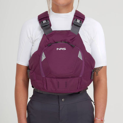Someone wearing an NRS maroon Ninja PFD over a white top and dark pants, standing against a plain background.