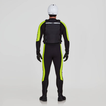 A person wearing a black wetsuit with yellow-green stripes, black gloves, boots, and a white helmet stands facing away while equipped with the NRS Big Water Guide Hi-Float PFD.
